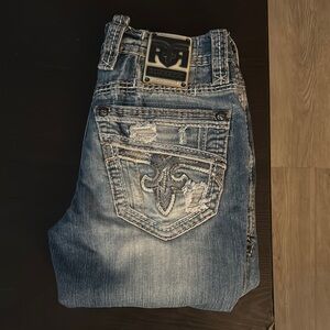 Rock Revival Blue Slim Straight Jeans with Distressing and Embroidered Design